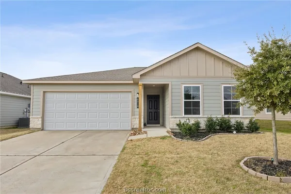 front view of a house with a yard