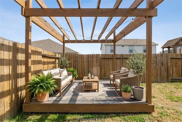 a view of sitting area with furniture and a yard