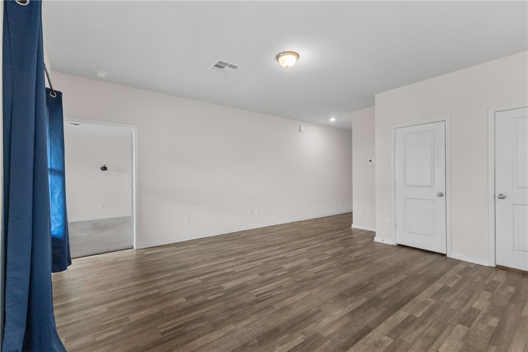 6018 Crest Bridge Bryan, TX 77807 - Photo 9 of 30 a view of an empty room with wooden floor