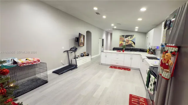 a room with furniture and a flat screen tv