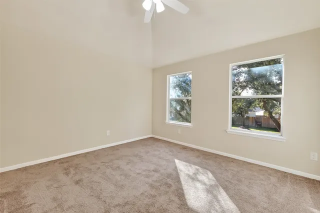 a bathroom with double vanity sinks and a mirror