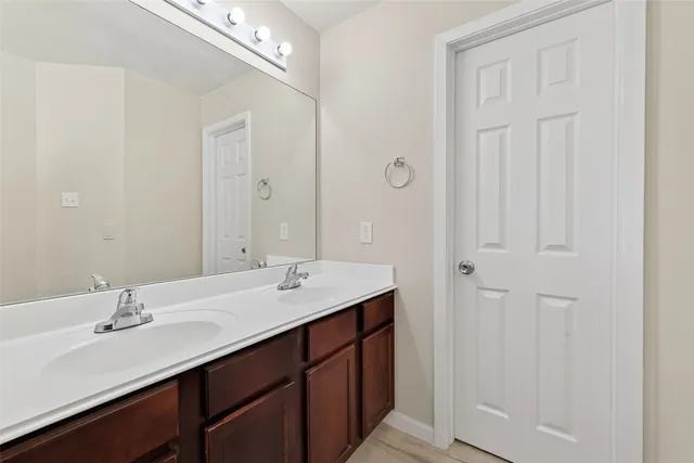 a view of backyard with wooden fence