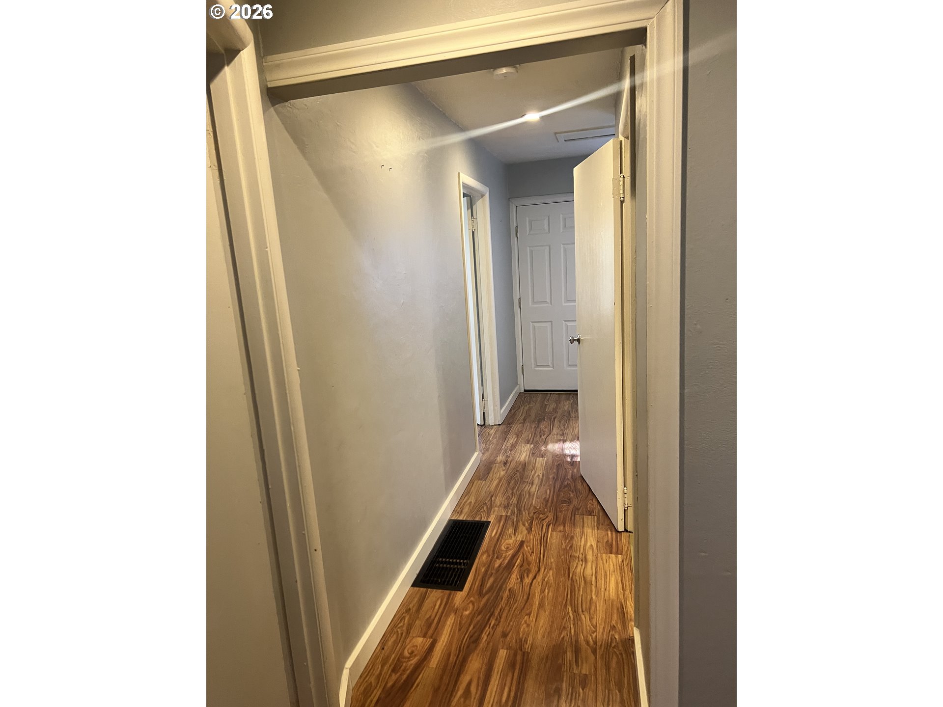 418 Northwest 9th Street Pendleton, OR 97801 - Photo 11 of 12 a view of a hallway with wooden floor and staircase