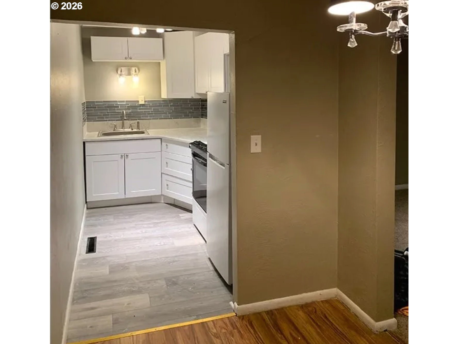 418 Northwest 9th Street Pendleton, OR 97801 - Photo 5 of 12 a bathroom with a sink a toilet and vanity