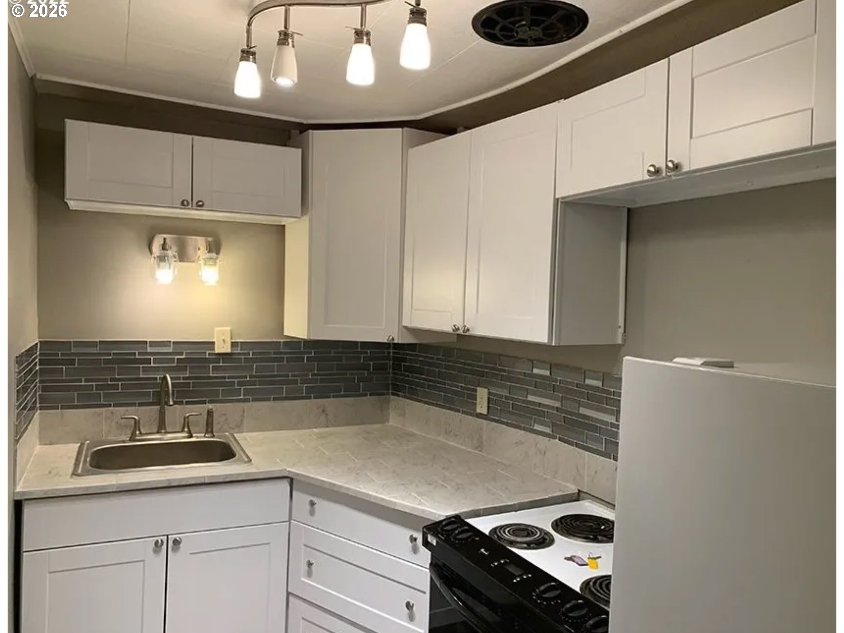 418 Northwest 9th Street Pendleton, OR 97801 - Photo 6 of 12 a kitchen with a sink and cabinets