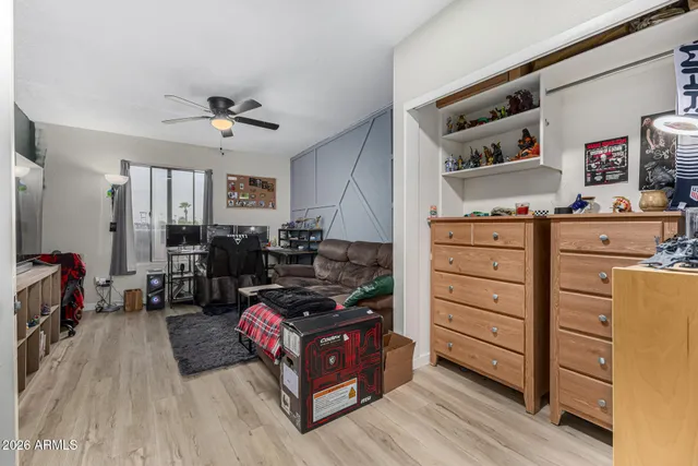 a bedroom with furniture and a dresser