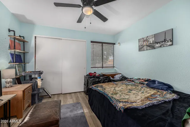 a bedroom with a bed and furniture