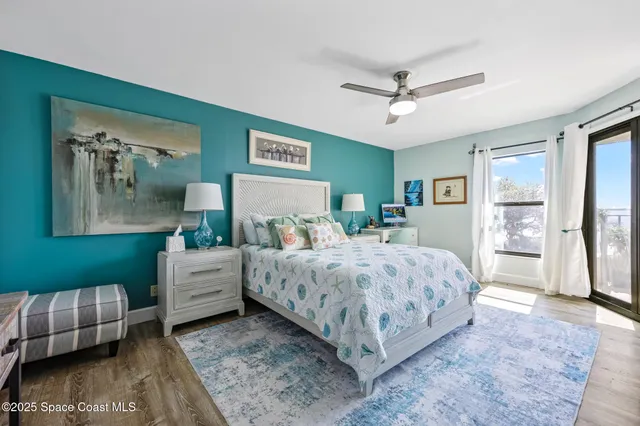 a spacious bedroom with a bed and a couch