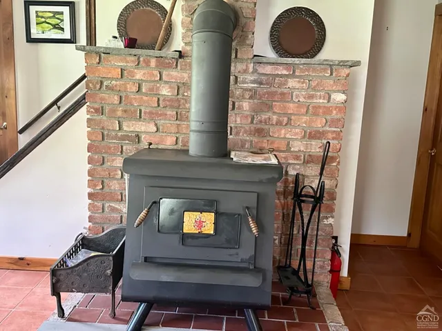 a stove top oven sitting inside of a kitchen