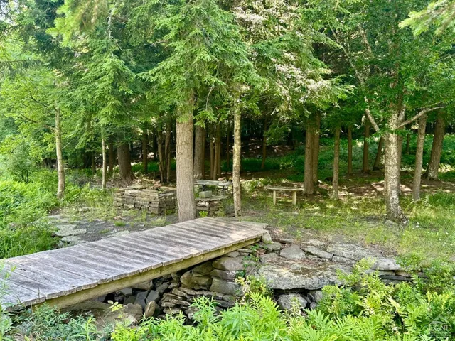 a view of a backyard with sitting area