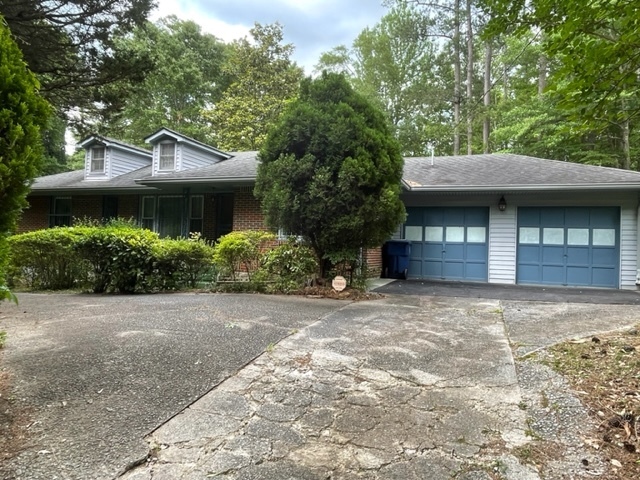 2122 Pemberton Road Southwest Atlanta, GA 30331 - Photo 1 of 1 a front view of a house with a garden