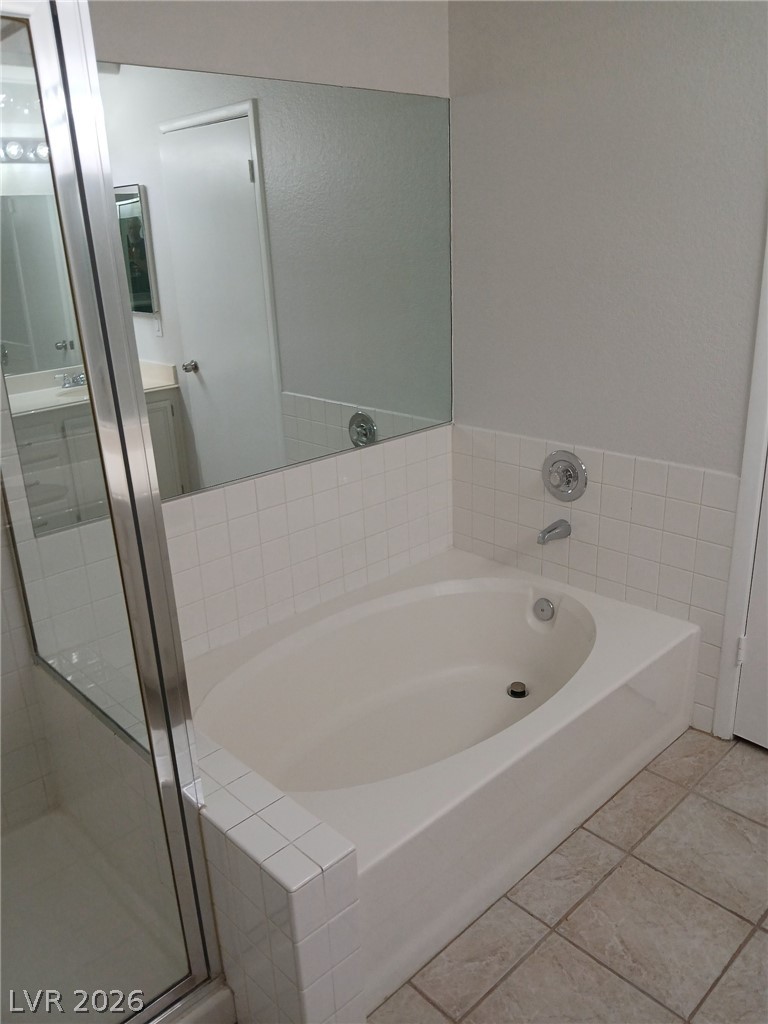 2201 Ramsgate Drive, Unit 426 Henderson, NV 89074 - Photo 17 of 22 This bathroom features a soaking tub, perfect for relaxation after a long day.
