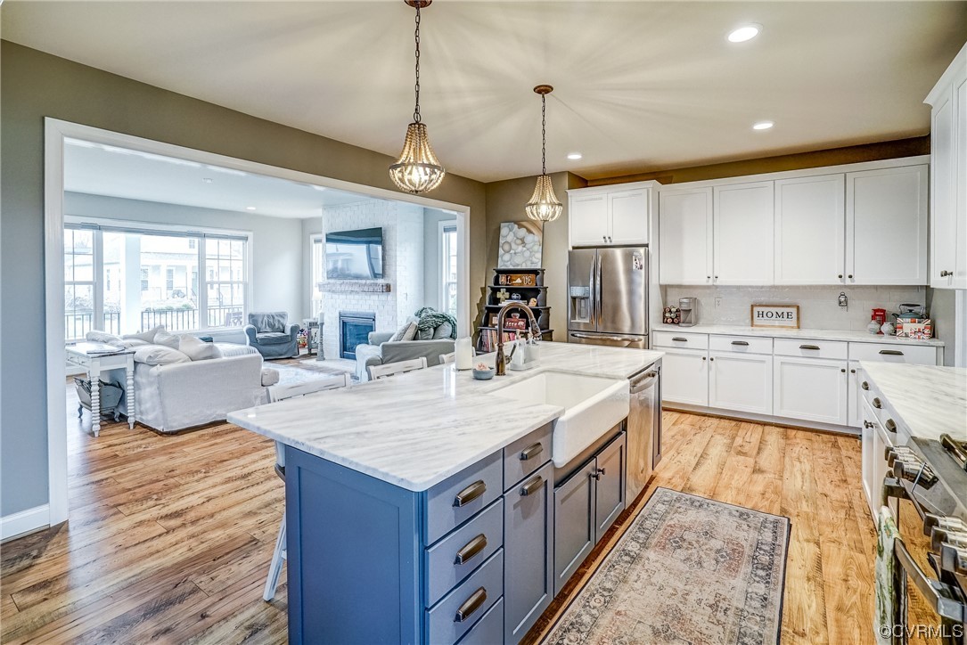 709 West Vaughan Road Ashland, VA 23005 - Photo 17 of 50 a large kitchen with kitchen island a large center island in it