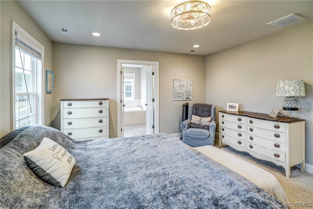 709 West Vaughan Road Ashland, VA 23005 - Photo 31 of 50 a bedroom with a bed and a chandelier