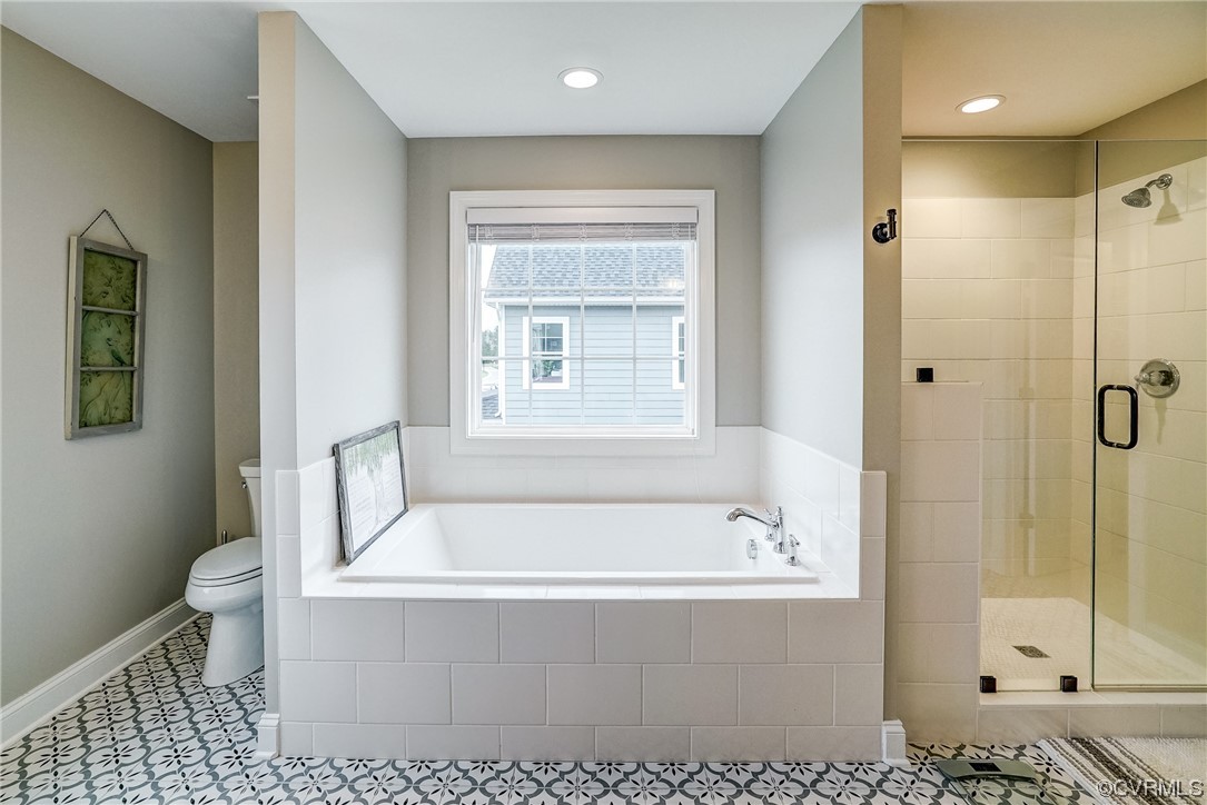 709 West Vaughan Road Ashland, VA 23005 - Photo 33 of 50 a white bath tub sitting next to a toilet