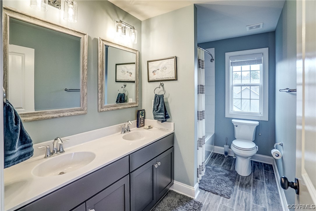 709 West Vaughan Road Ashland, VA 23005 - Photo 41 of 50 a bathroom with a sink a toilet and shower