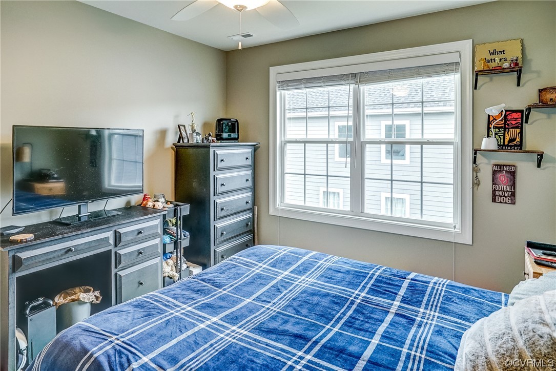 709 West Vaughan Road Ashland, VA 23005 - Photo 43 of 50 a bedroom with a bed and a flat screen tv