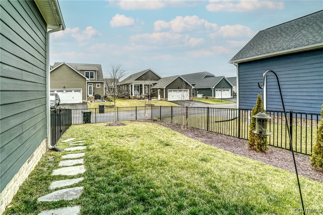 709 West Vaughan Road Ashland, VA 23005 - Photo 50 of 50 a view of a house with a wooden deck and a garden