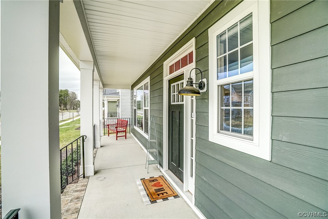 709 West Vaughan Road Ashland, VA 23005 - Photo 6 of 50 a view of a balcony with wooden floor and door