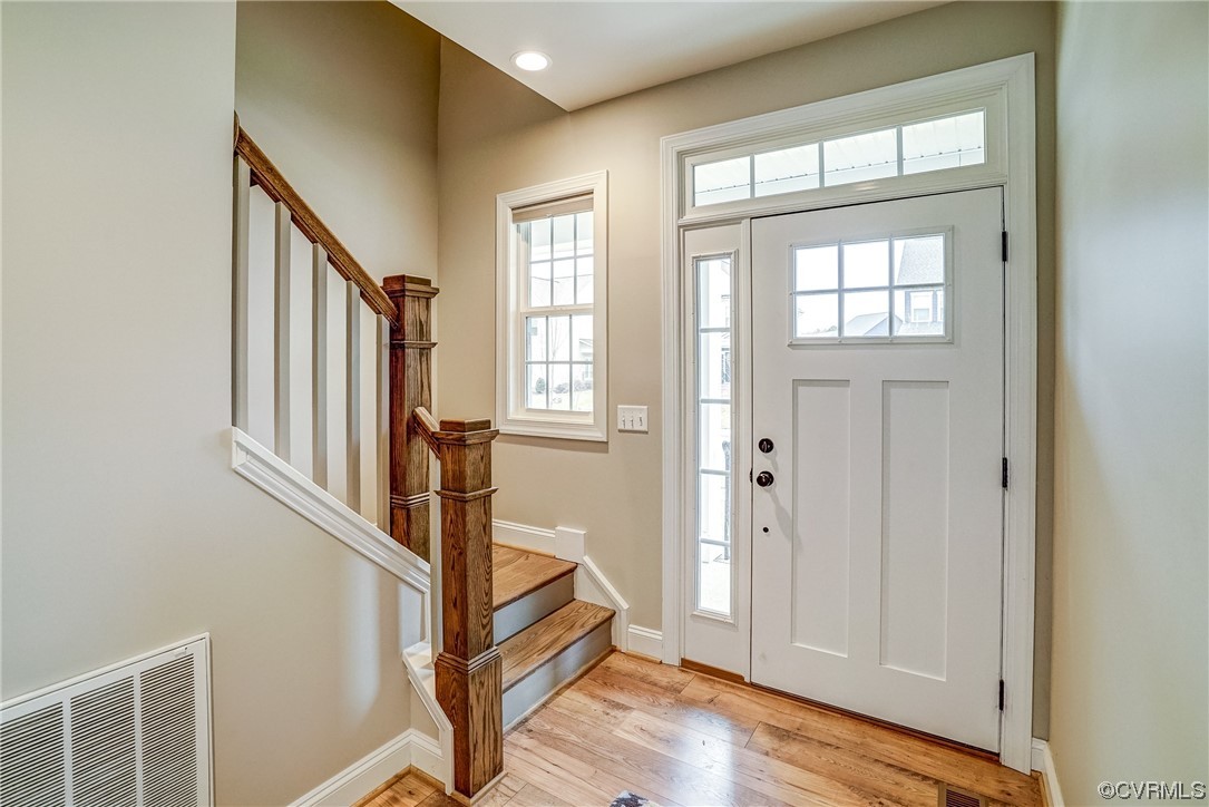 709 West Vaughan Road Ashland, VA 23005 - Photo 8 of 50 a view of an entryway with wooden floor and door