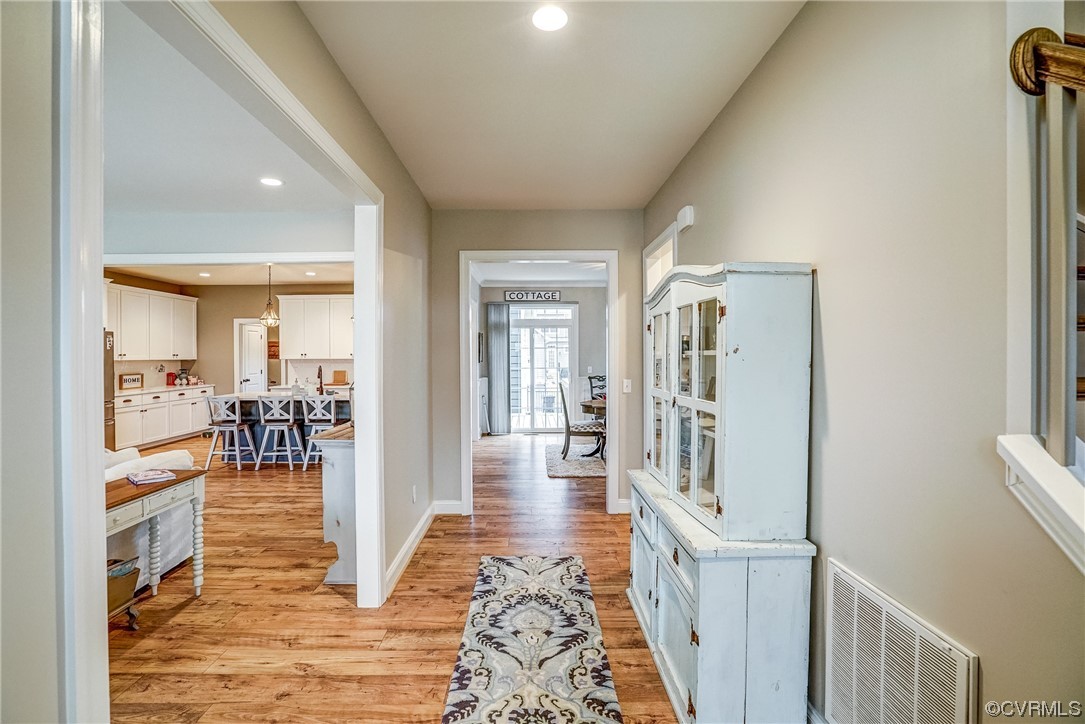 709 West Vaughan Road Ashland, VA 23005 - Photo 9 of 50 a view of a hallway view with living room and wooden floor
