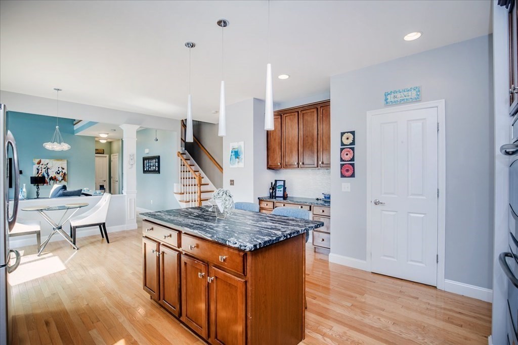 11 Sparrow Lane Danvers, MA 01923 - Photo 16 of 41 a kitchen with stainless steel appliances granite countertop a stove a sink and a refrigerator