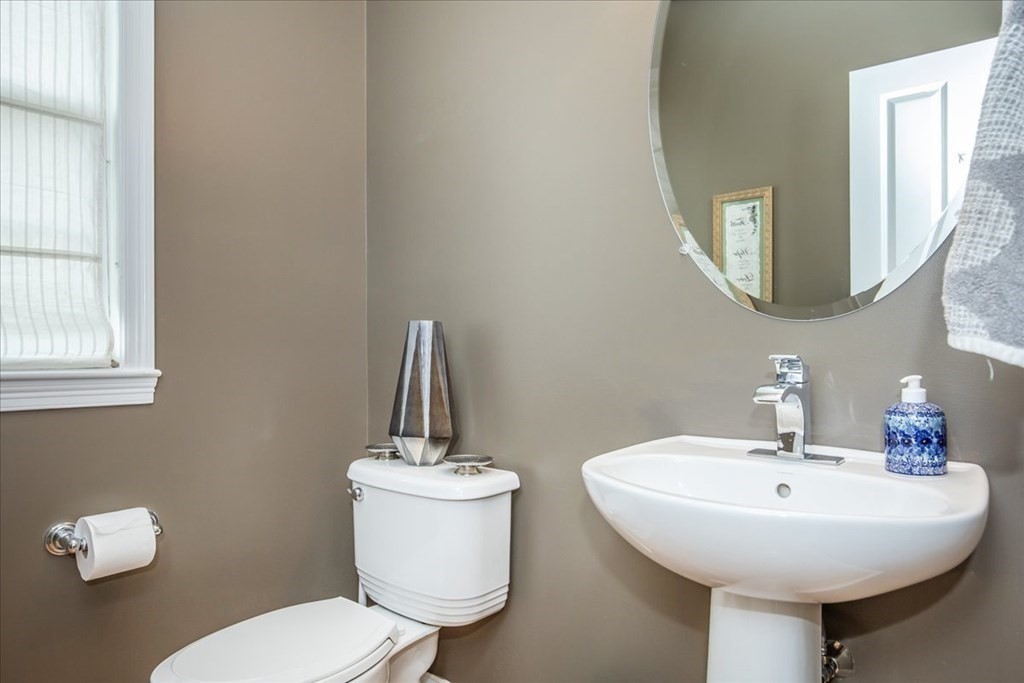 11 Sparrow Lane Danvers, MA 01923 - Photo 20 of 41 a bathroom with a toilet sink and mirror