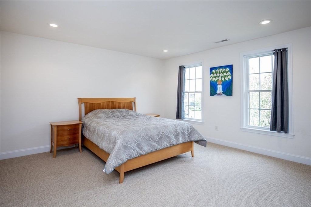 11 Sparrow Lane Danvers, MA 01923 - Photo 26 of 41 a bed sitting in a spacious bedroom next to a window