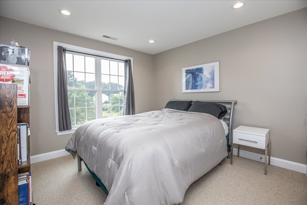 11 Sparrow Lane Danvers, MA 01923 - Photo 28 of 41 a bedroom with a bed and a window