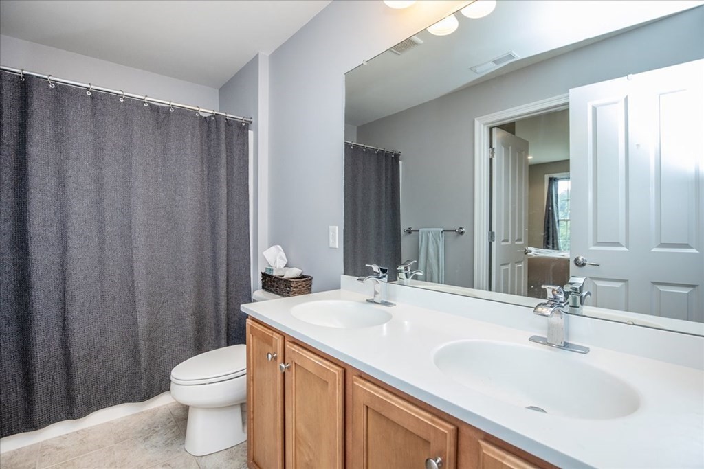 11 Sparrow Lane Danvers, MA 01923 - Photo 30 of 41 a bathroom with a sink a toilet and shower