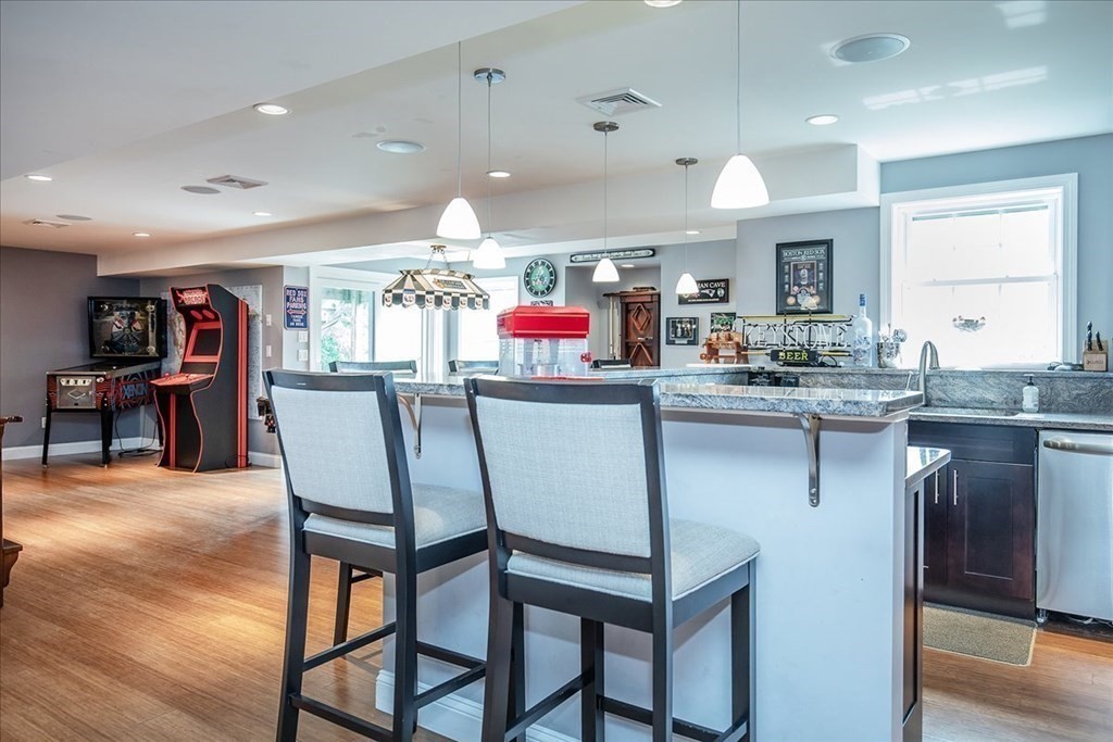 11 Sparrow Lane Danvers, MA 01923 - Photo 32 of 41 a kitchen that has a table and chairs in it