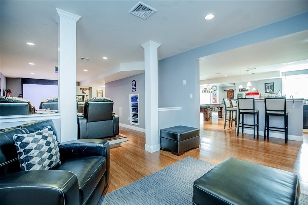 11 Sparrow Lane Danvers, MA 01923 - Photo 34 of 41 a living room with furniture and a wooden floor