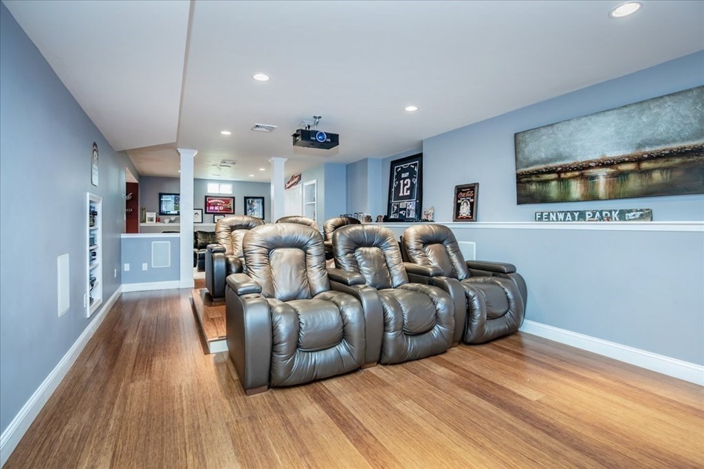 11 Sparrow Lane Danvers, MA 01923 - Photo 35 of 41 a living room with furniture a flat screen tv and kitchen view