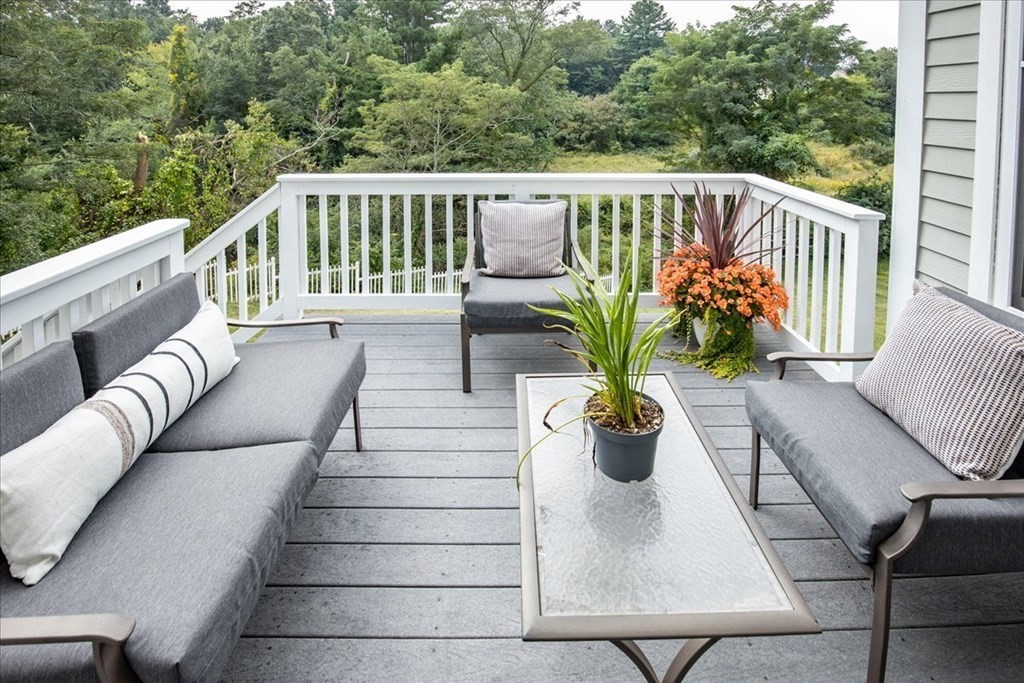 11 Sparrow Lane Danvers, MA 01923 - Photo 39 of 41 a balcony with potted plants and wooden floor