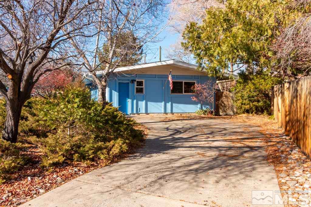 1355 Tacoma Way Reno, NV 89509 - Photo 2 of 22 a view of a house with a yard covered with snow