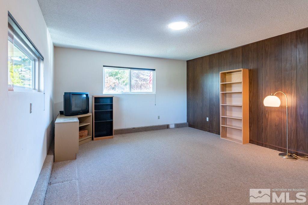 1355 Tacoma Way Reno, NV 89509 - Photo 22 of 22 an empty room with windows cabinet and fire place