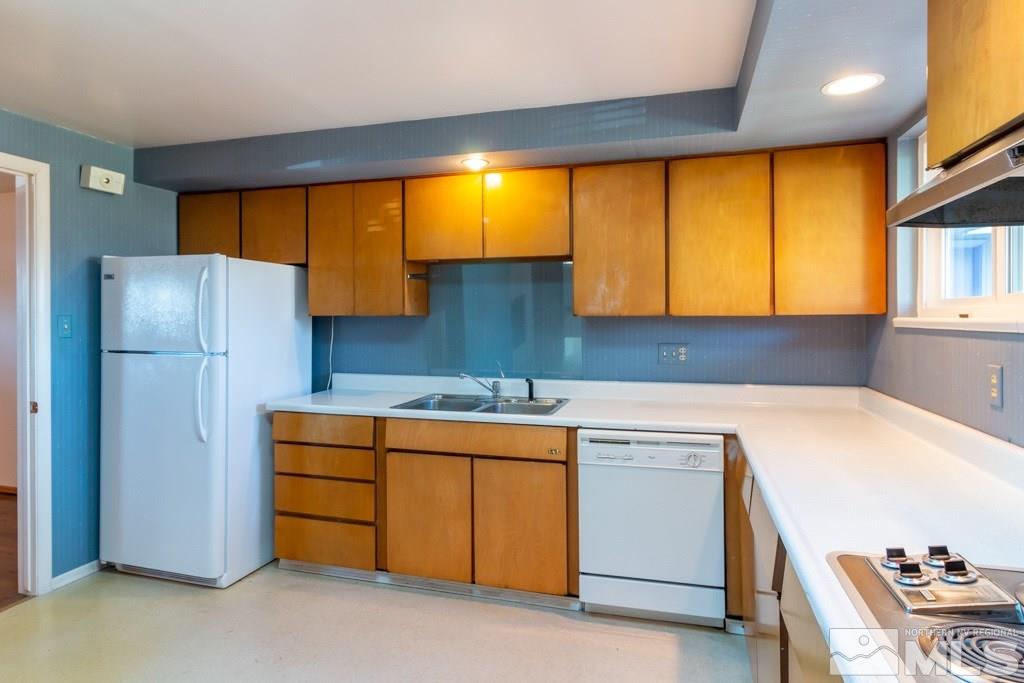 1355 Tacoma Way Reno, NV 89509 - Photo 8 of 22 a kitchen with a refrigerator and a sink