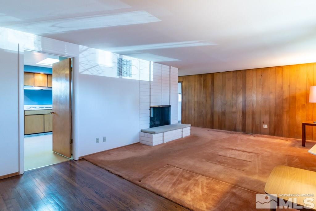1355 Tacoma Way Reno, NV 89509 - Photo 9 of 22 a bedroom with a bed and wooden floor
