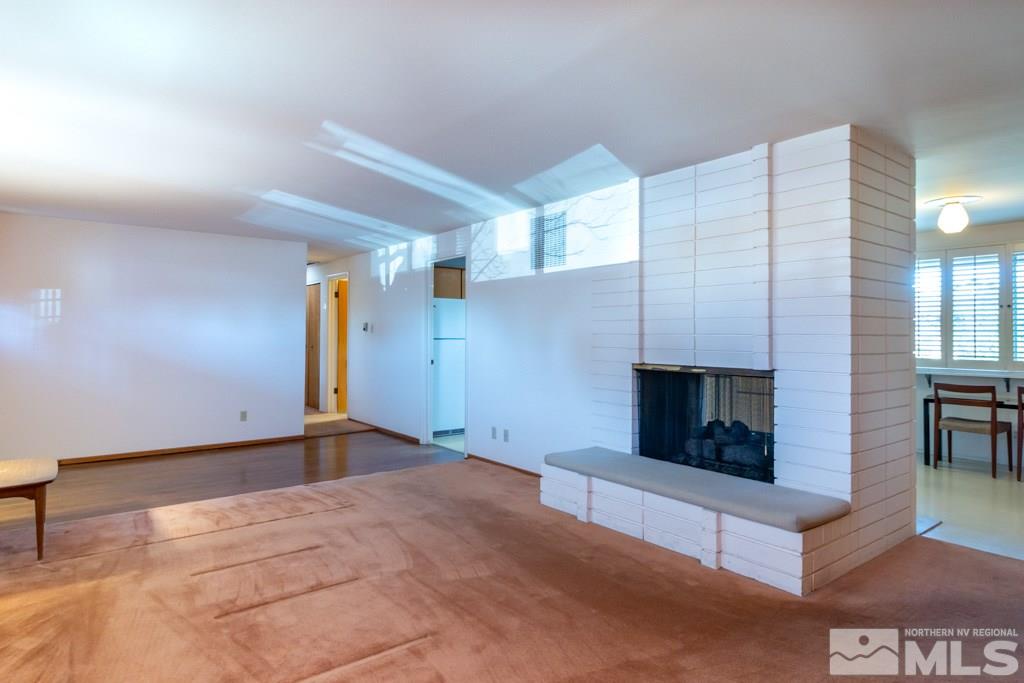 1355 Tacoma Way Reno, NV 89509 - Photo 10 of 22 a living room with furniture and a fireplace