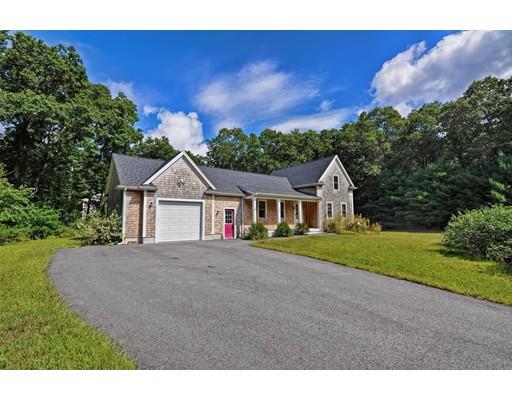 3 Forest Street Plympton, MA 02367 - Photo 3 of 42 a front view of a house with a yard and garage