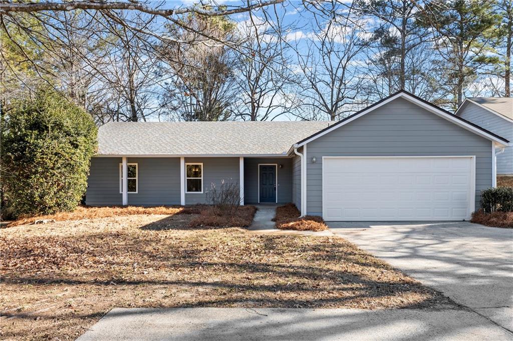 2592 Hewatt Road Snellville, GA 30039 - Photo 1 of 1 a front view of a house with a yard and garage