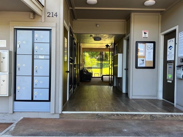 4435 Lower Honoapiilani Road, Unit 225 Lahaina, HI 96761 - Photo 21 of 35 a view of a hallway with wooden floor and a living room