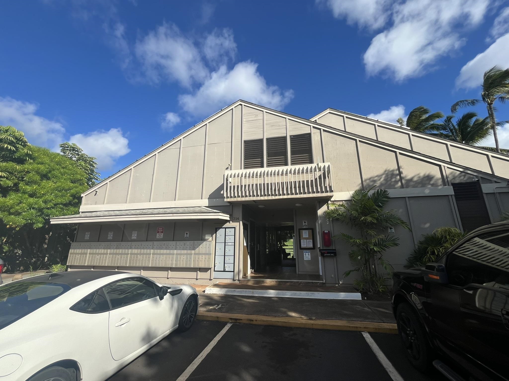 4435 Lower Honoapiilani Road, Unit 225 Lahaina, HI 96761 - Photo 22 of 35 a front view of a house with a garden