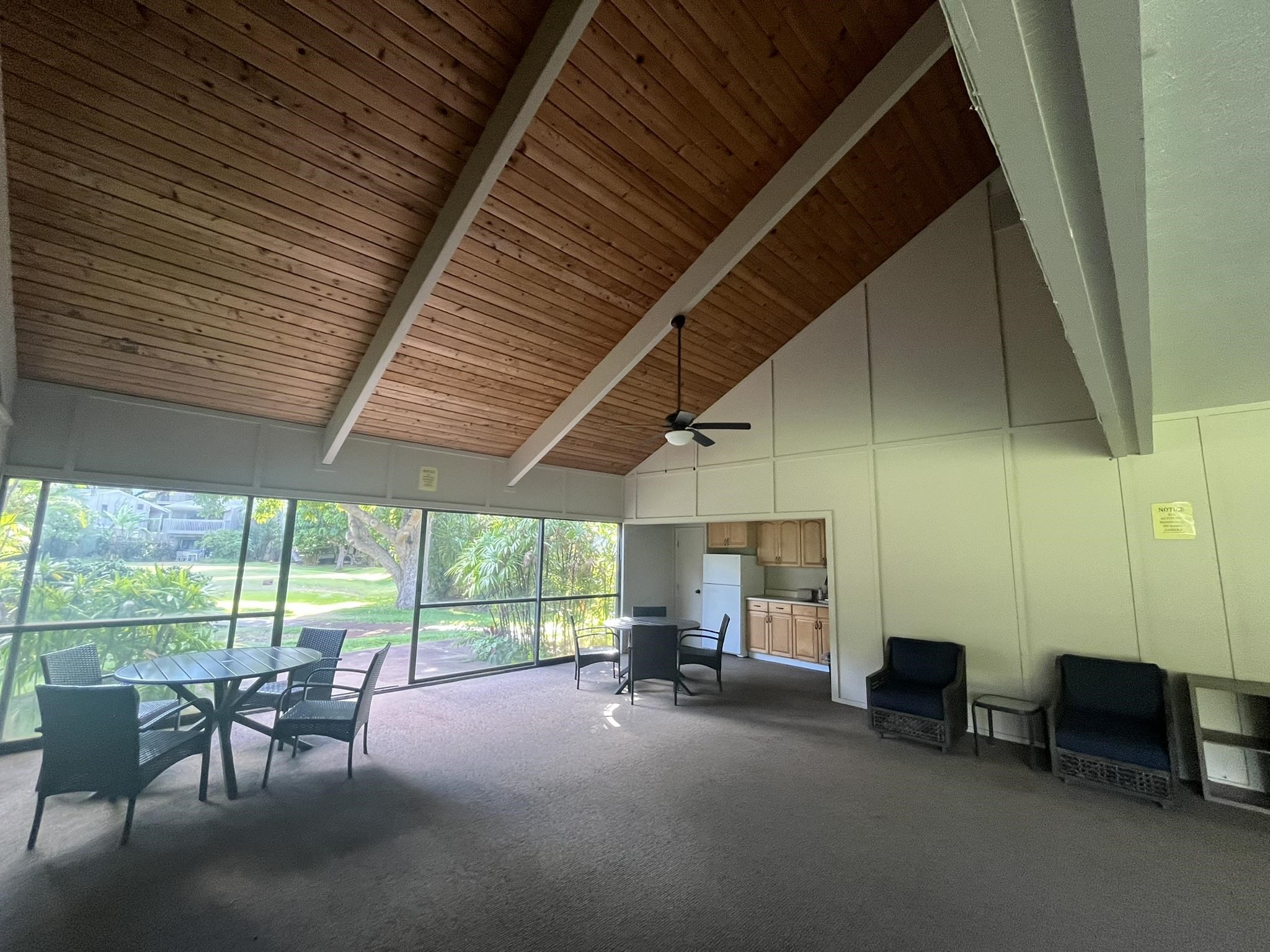 4435 Lower Honoapiilani Road, Unit 225 Lahaina, HI 96761 - Photo 23 of 35 a view of a patio with table and chairs under an umbrella