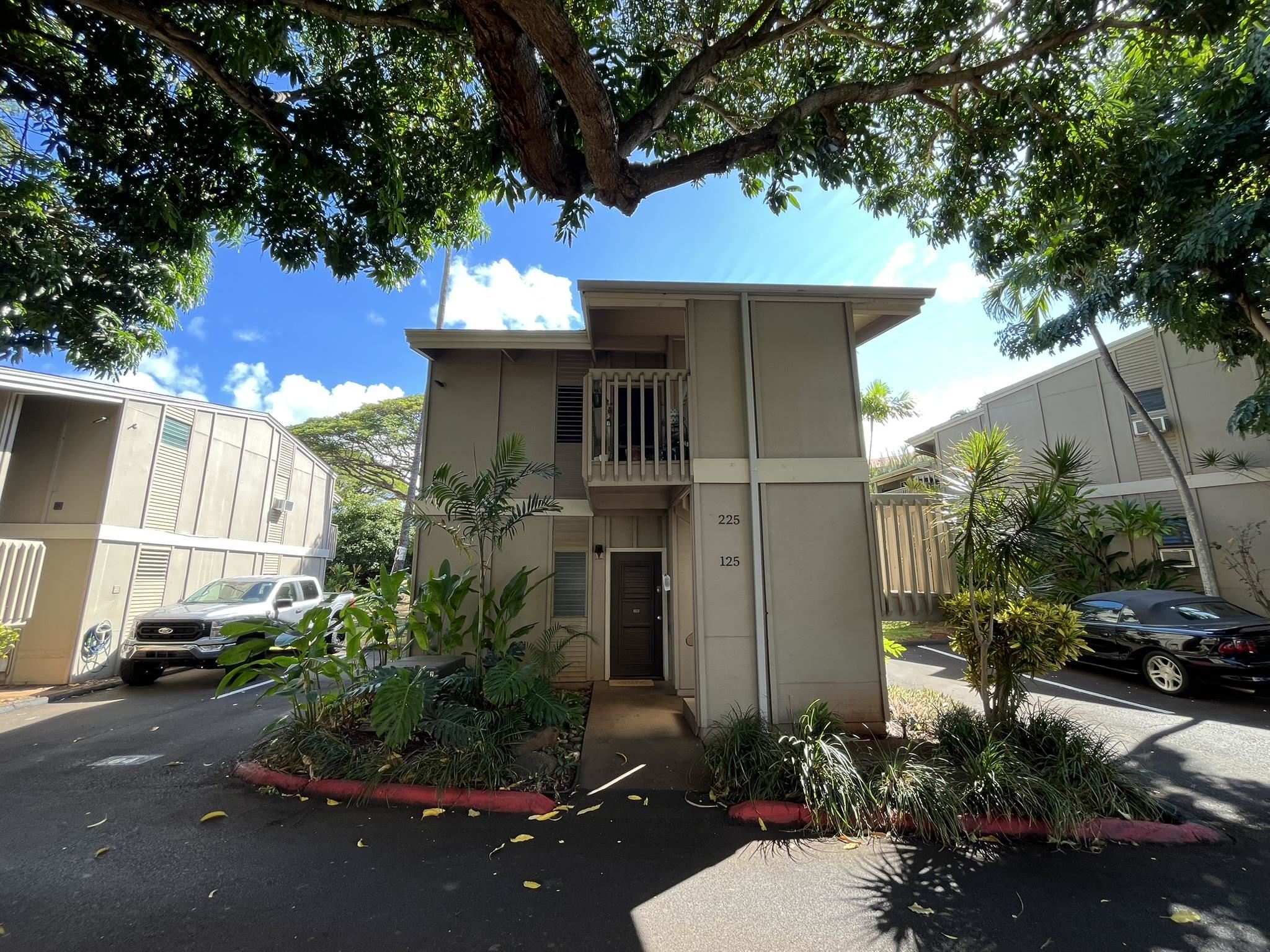 4435 Lower Honoapiilani Road, Unit 225 Lahaina, HI 96761 - Photo 33 of 35 a front view of a house with yard