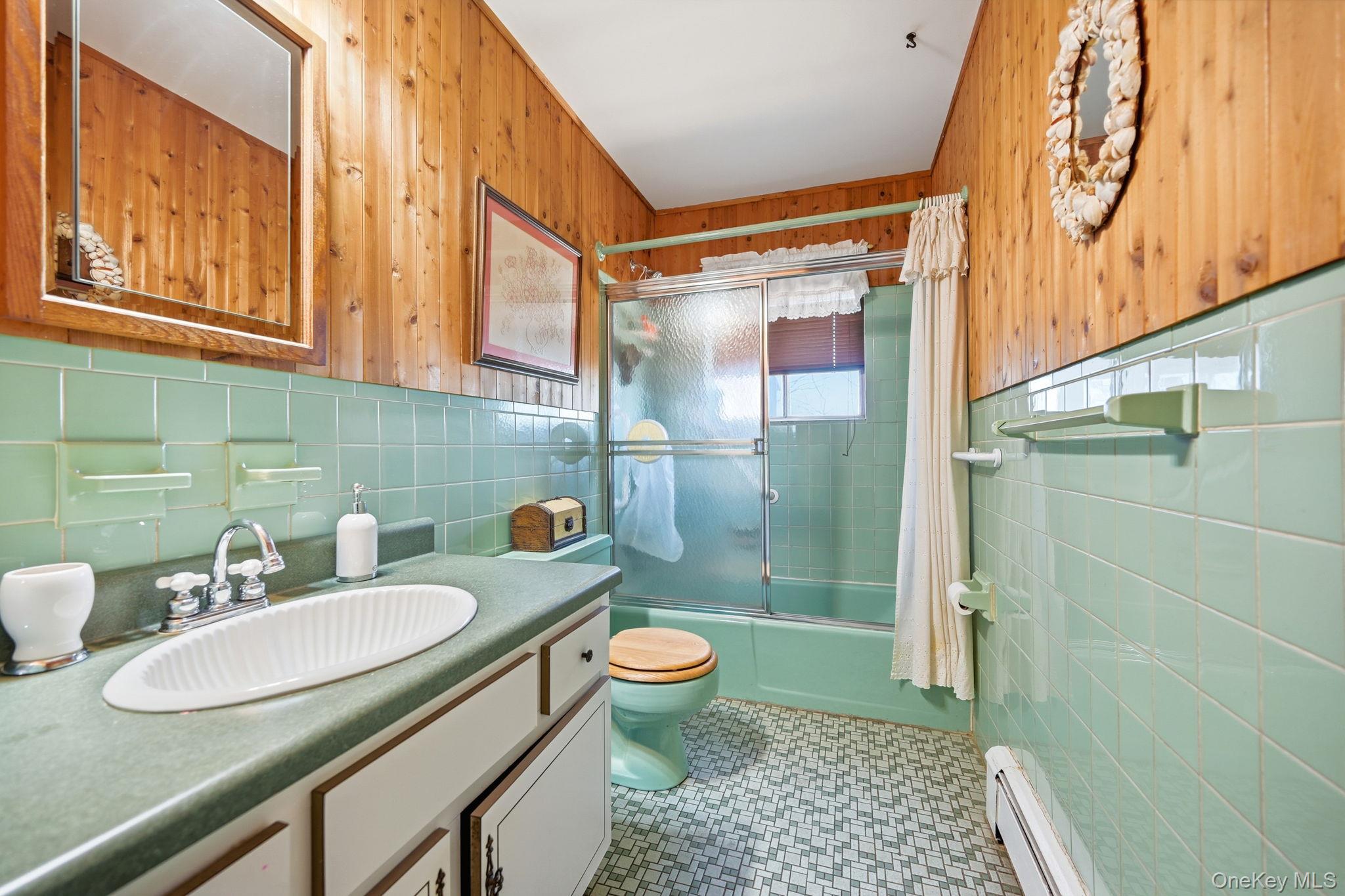 50 Everett Road Carmel, NY 10512 - Photo 11 of 23 a bathroom with a sink a toilet and shower