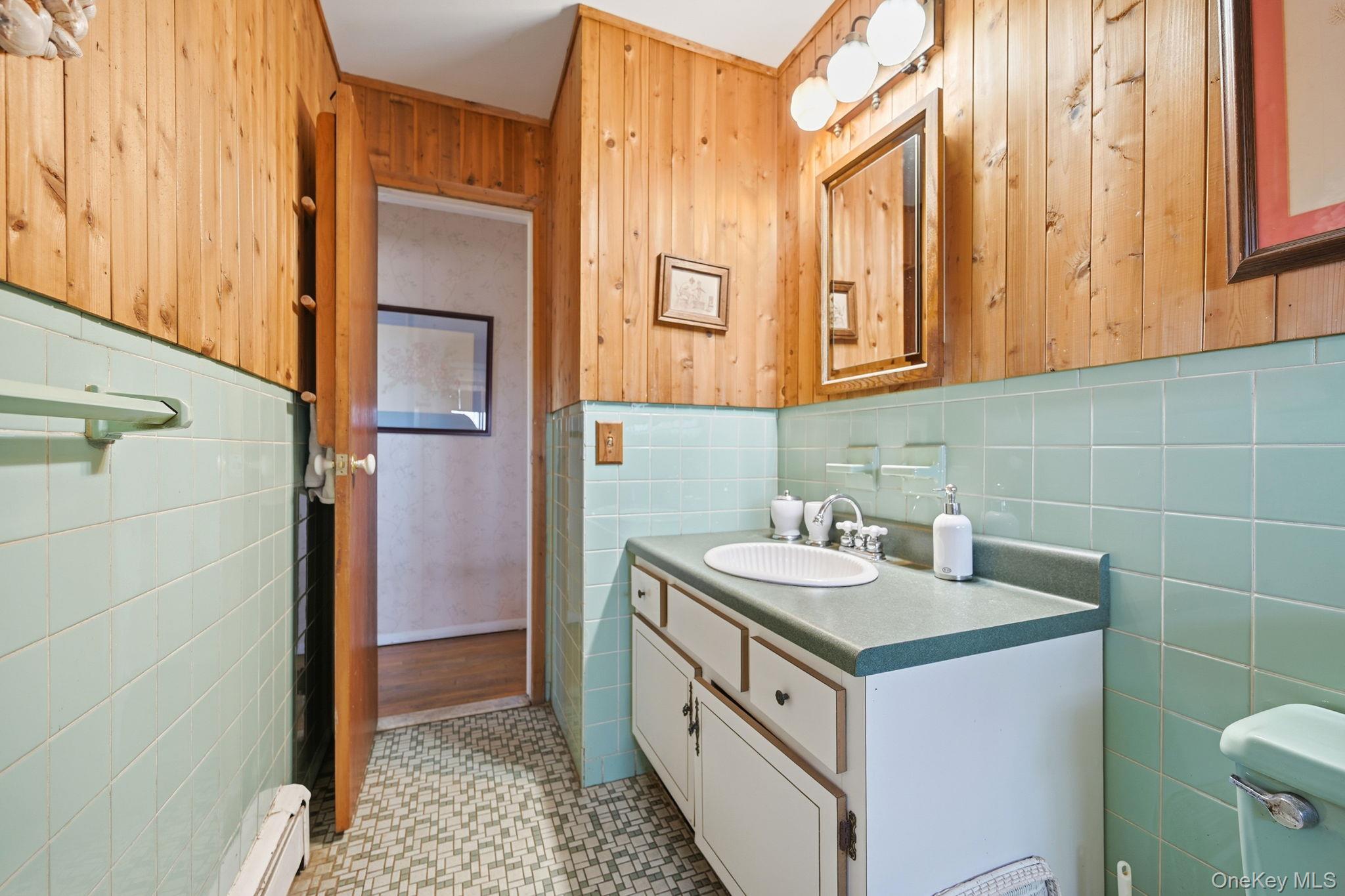 50 Everett Road Carmel, NY 10512 - Photo 12 of 23 a bathroom with a sink and a mirror