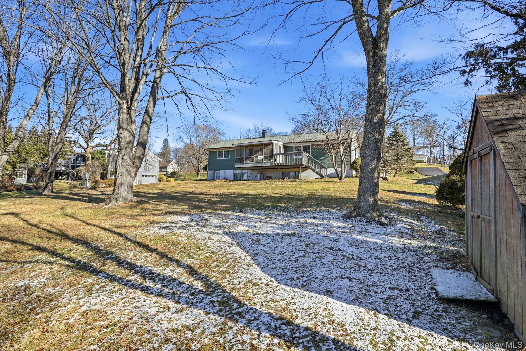 50 Everett Road Carmel, NY 10512 - Photo 20 of 23 a view of a yard with fountain in front of a house