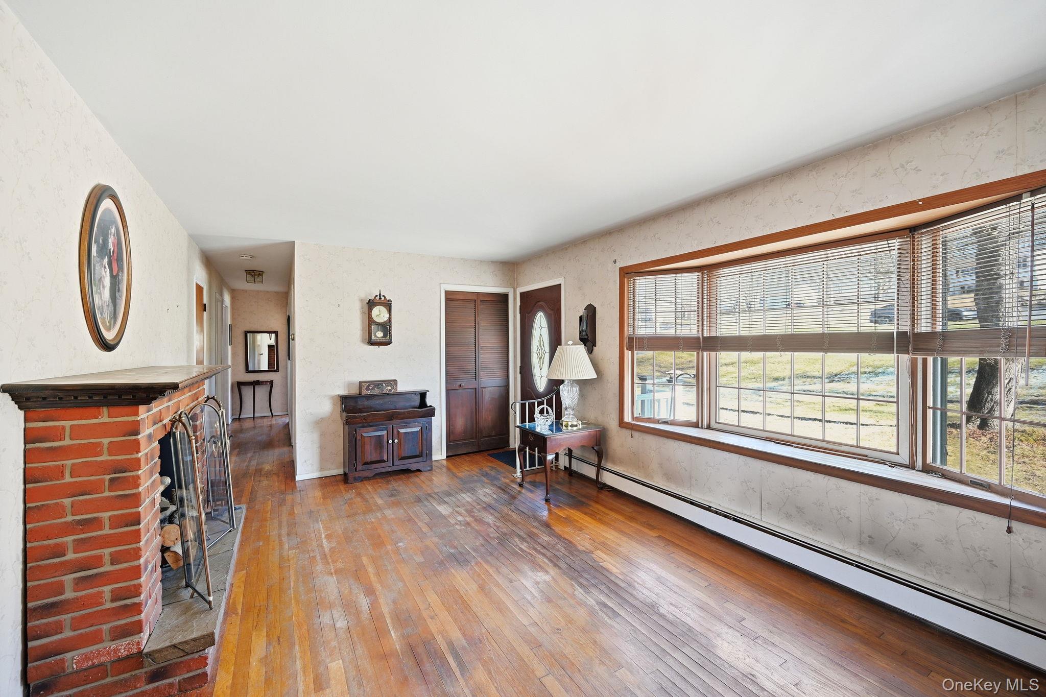 50 Everett Road Carmel, NY 10512 - Photo 3 of 23 a living room with furniture and a wooden floor