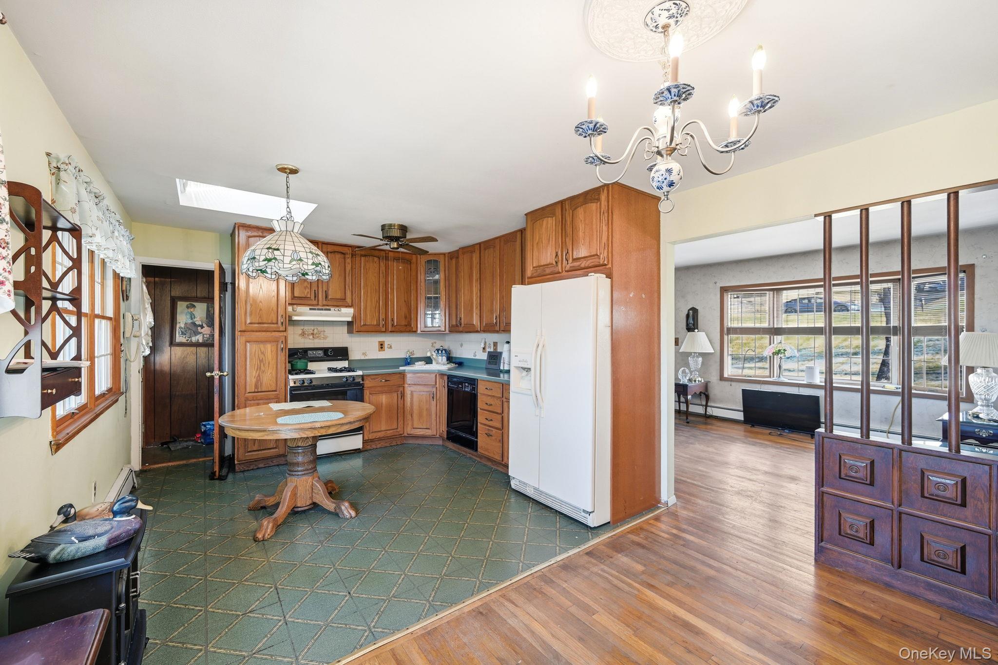 50 Everett Road Carmel, NY 10512 - Photo 5 of 23 a living room with lots of furniture and a chandelier